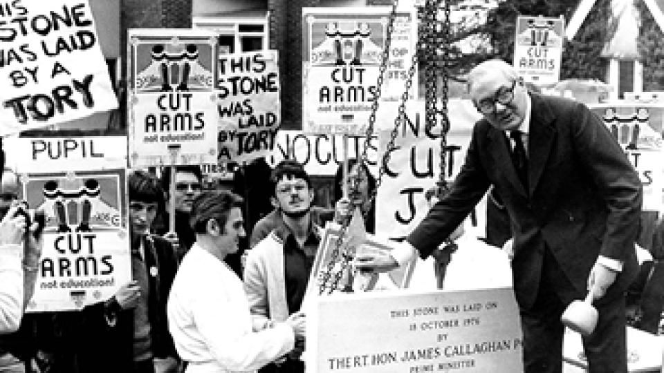 Labour Prime Minister James Callaghan speaks at Ruskin about public education with banners people surrounding him.