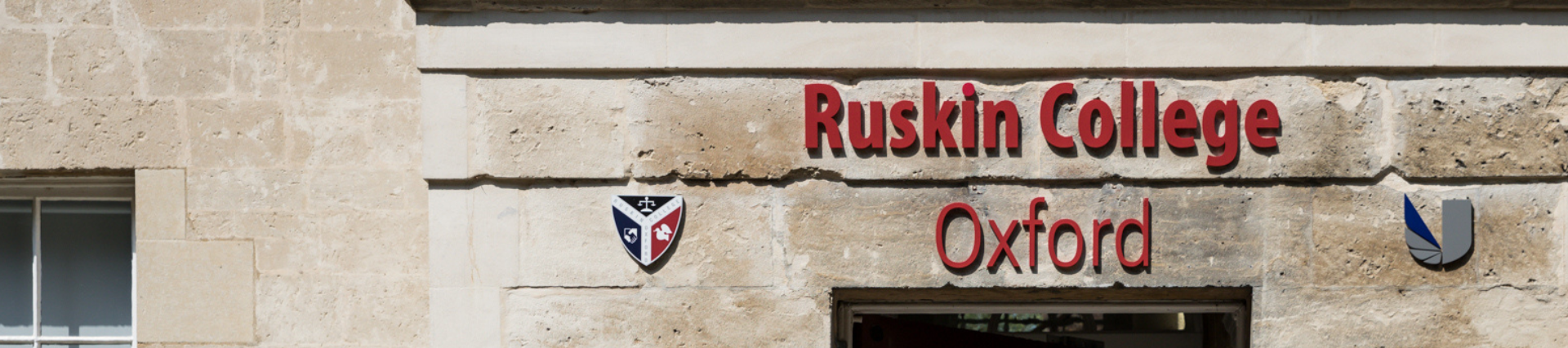 Ruskin College Oxford sign with the logo outside the entrance of the building.